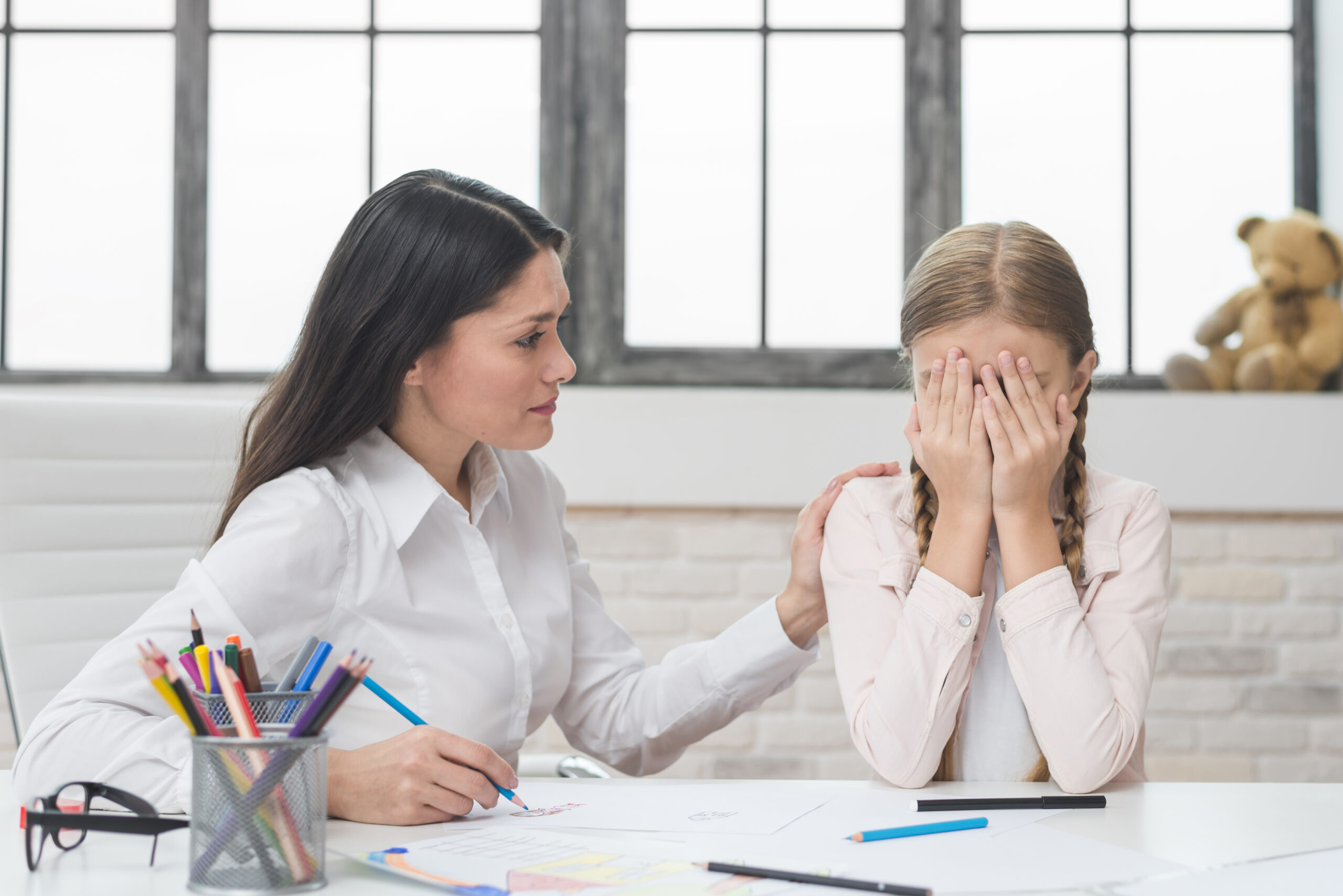 psychologist-supporting-girl-suffering-from-depression